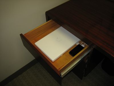 13" MacBook Core 2 Duo in desk drawer. Wakes up from sleep automatically when in range of paired Bluetooth keyboard. Just start typing.