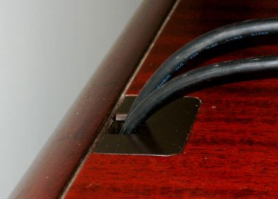 Monitor cables wired through desktop -- so that's what those little inserts are for.